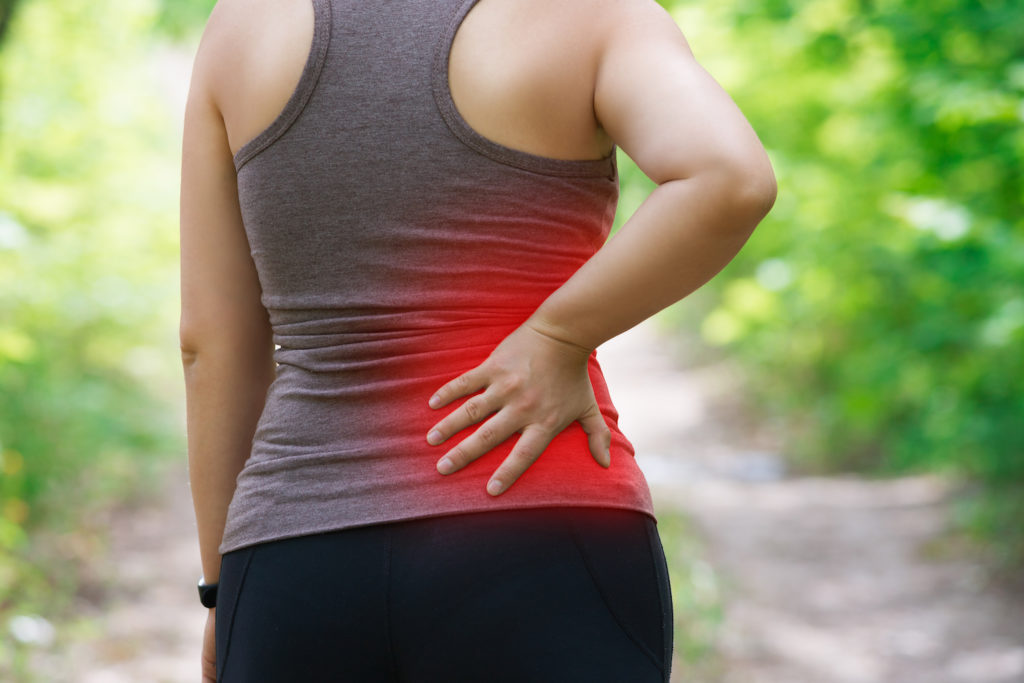 woman having sciatica pain
